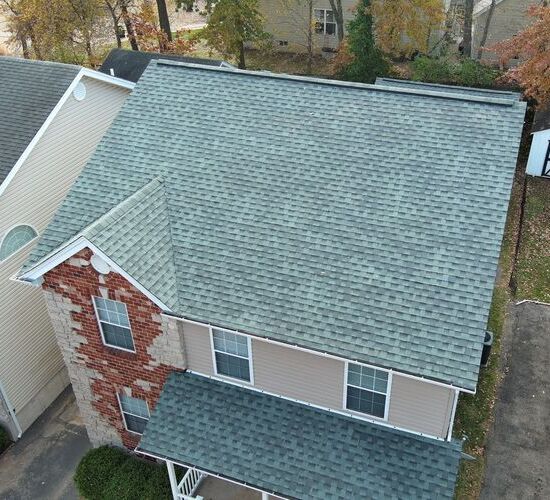 a home with a shingle roof