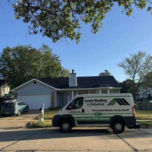 a van in front of a home with a shingle roof